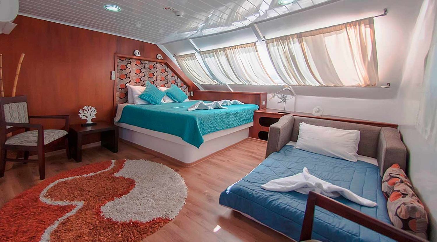 double queen size bed bedroom of anahi catamaran yacht of galapagos islands