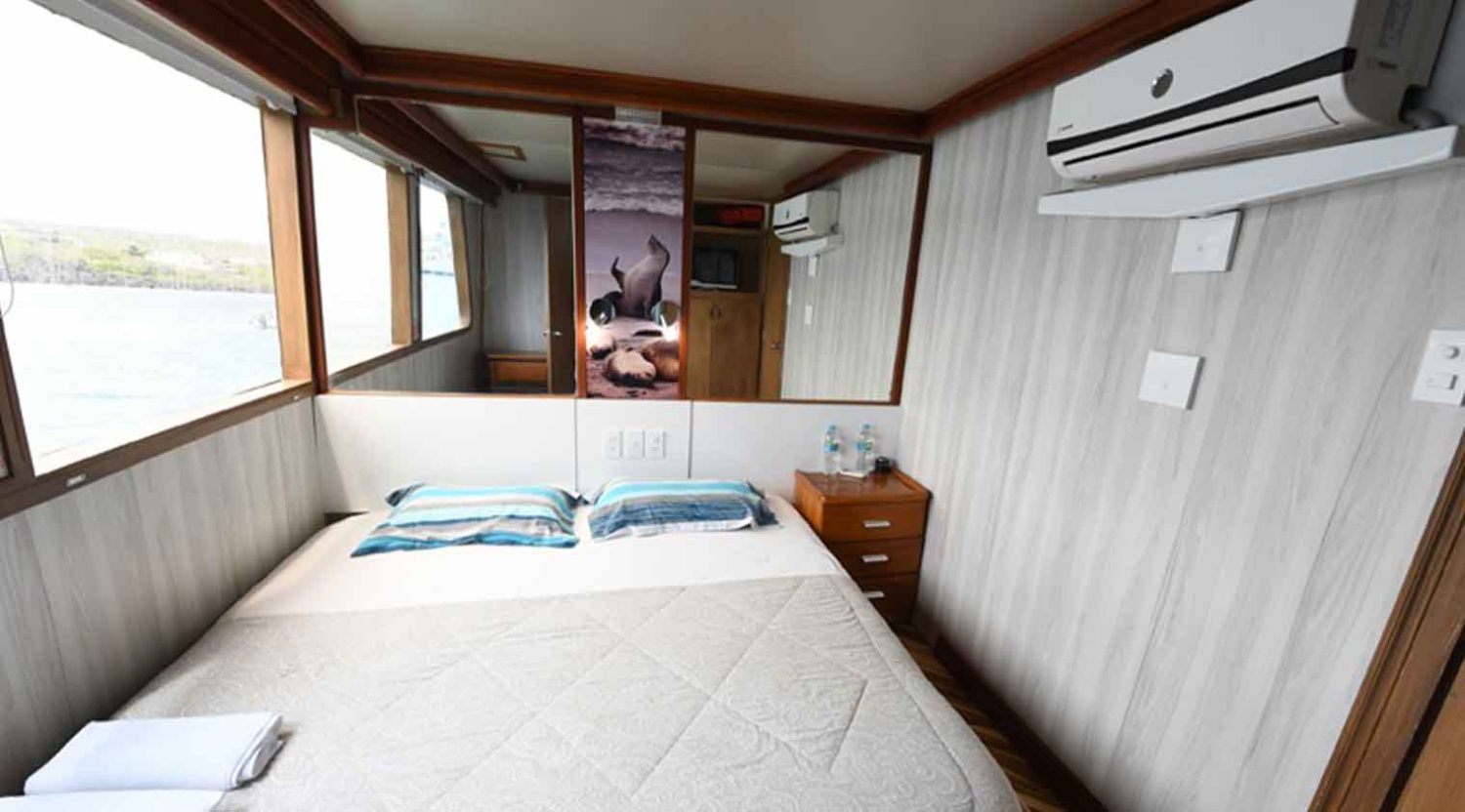 queen size bed bedroom of humboldt explorer yacht of galapagos islands
