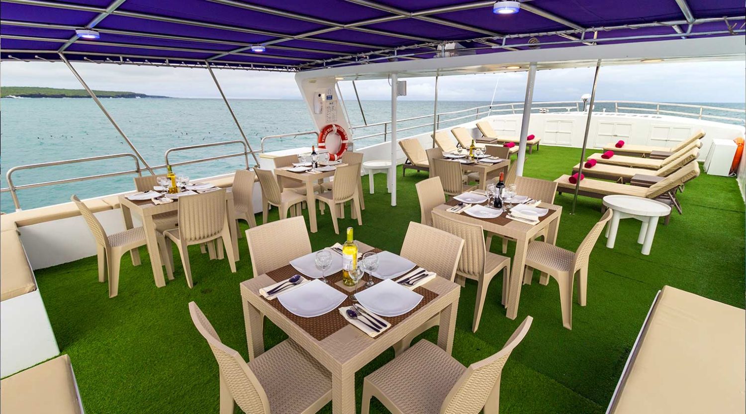 outdoor dining room of monserrat yacht of galapagos islands
