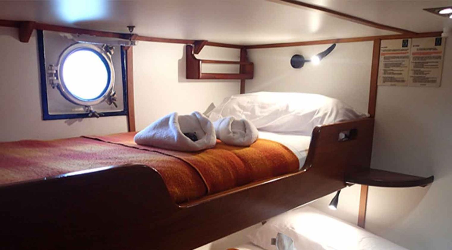 double bed bedroom of samba yacht of galapagos islands