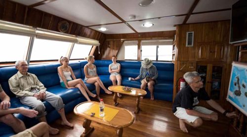 meeting on te living room of fragata yacht of galapagos islands tours