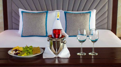 Grand Majestic Galapagos Yacht king sized bed bedroom of galapagos islands tours