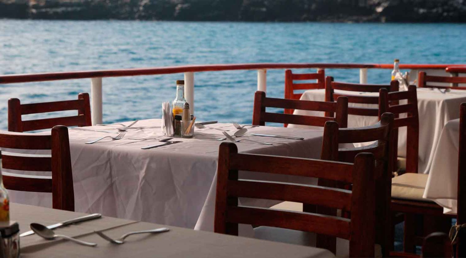 millenium catamaran yacht outdoor dining room of galapagos islands tours