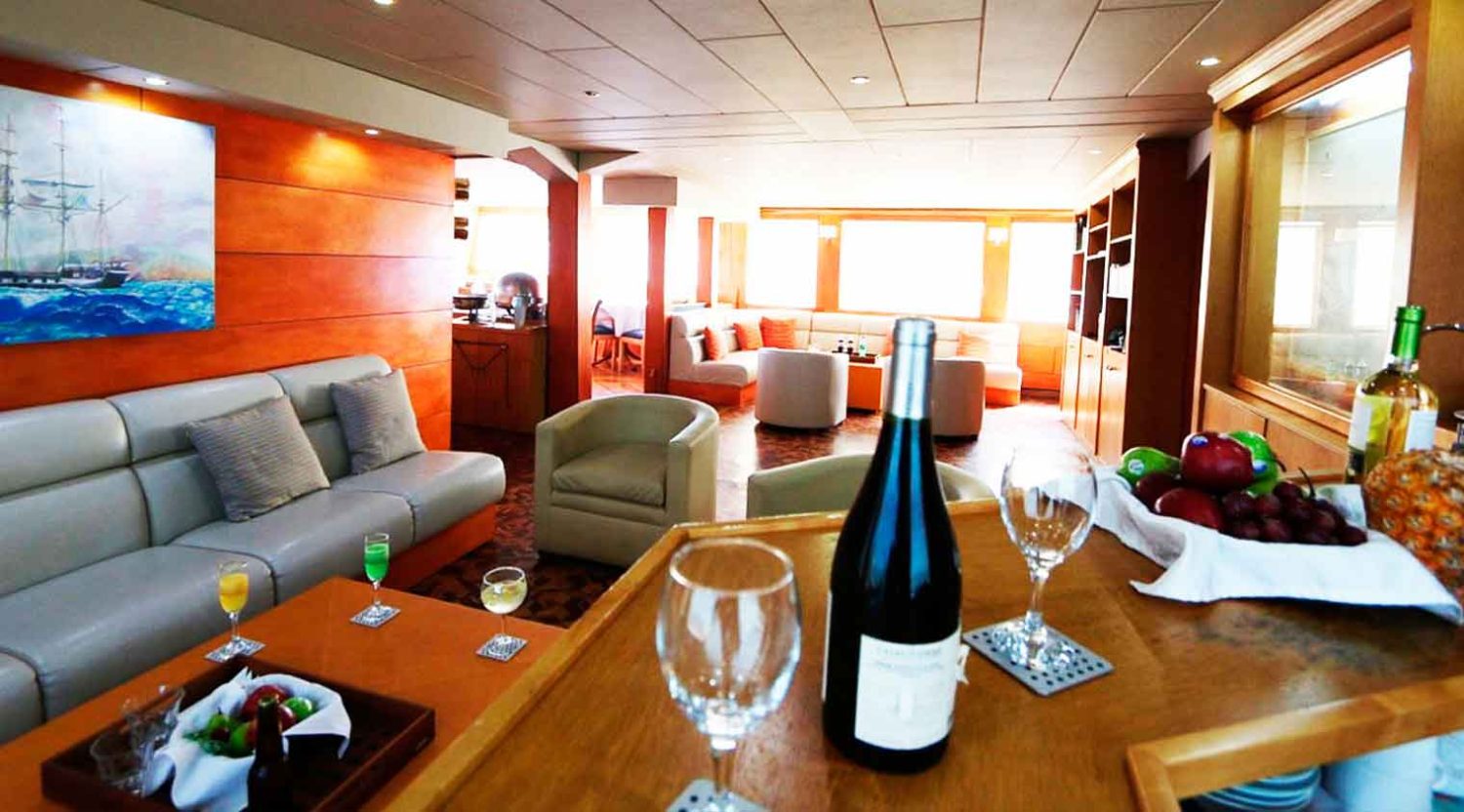 millenium catamaran yacht living room of galapagos islands tours