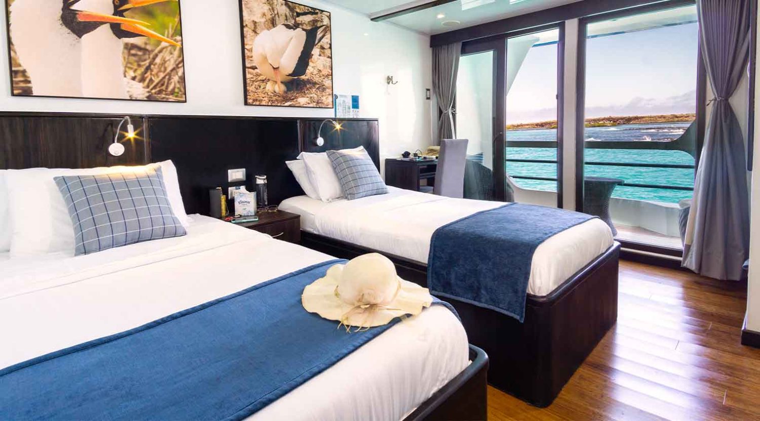 Natural Paradise Yacht double bed bedroom of galapagos islands tours