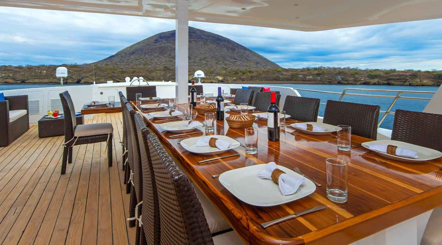 outdoor dining room of natural paradise yacht of galapagos islands tours