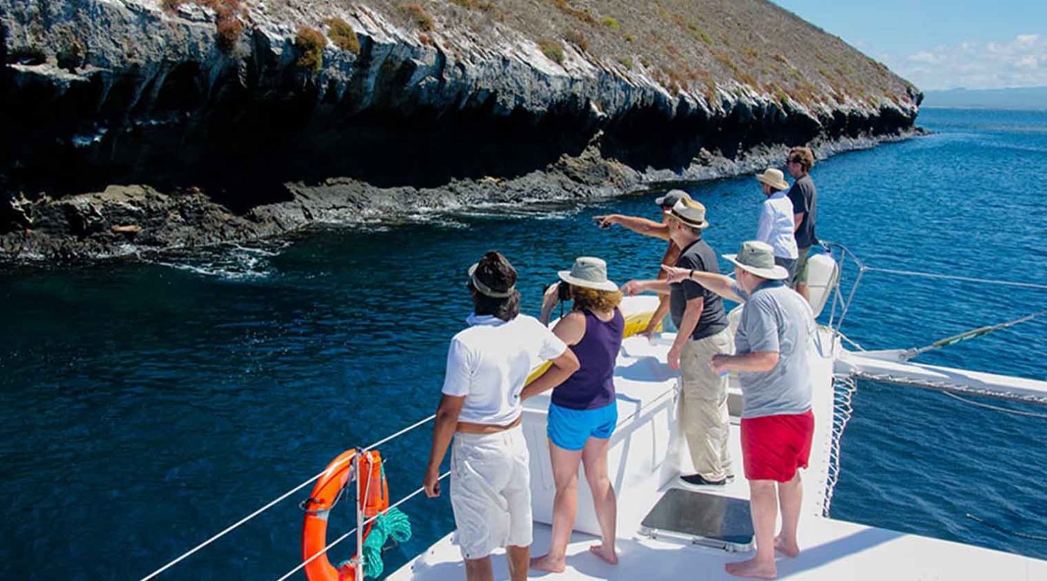 nemo 2 yacht tourists taking photo in the deck of galapagos islands tours