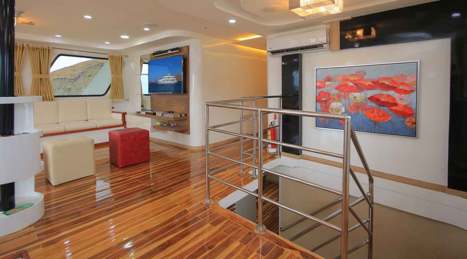 living room of grand queen beatriz yacht of galapagos islands tours