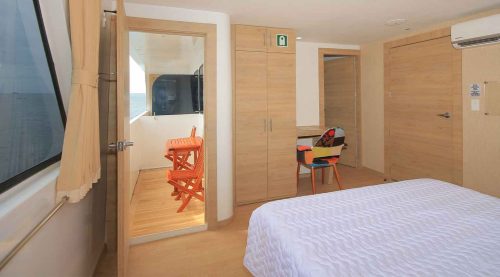 Grand Queen Beatriz Yacht queen size bed bedroom of galapagos islands tours