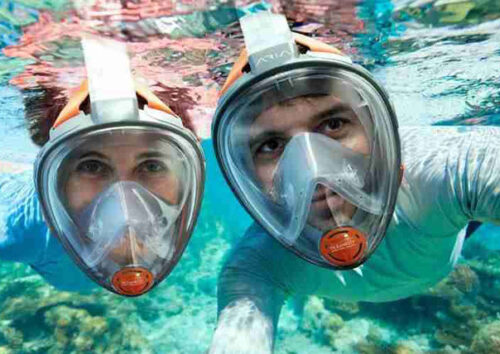 scuba diving taking photo of galapagos islands tours